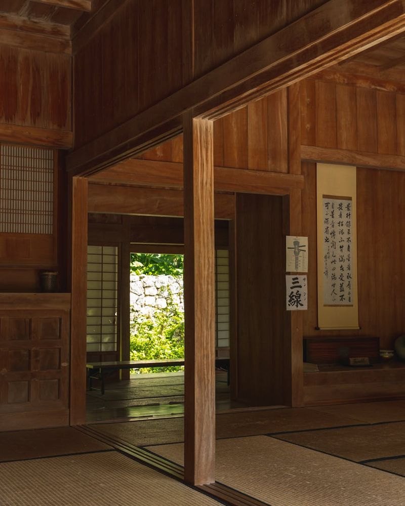 Bright and spacious room with a yoga mat on a wooden floor.